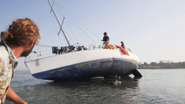 Inspecting the hull after getting stuck on a rock