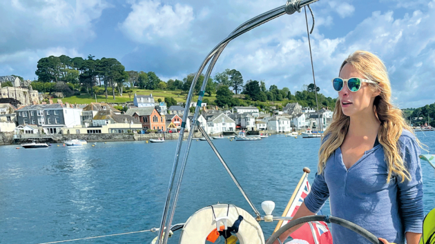 Georgie helms the yacht out of Fowey