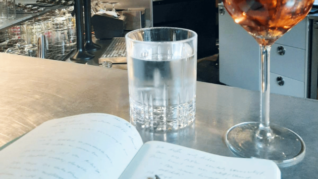Detlef makes notes while enjoying a glass of wine