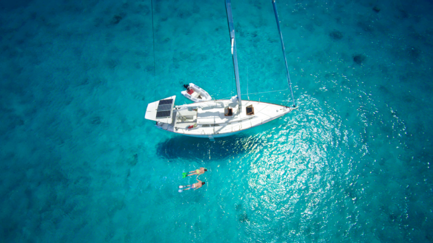 Aerial photo of a yacht with solar panels