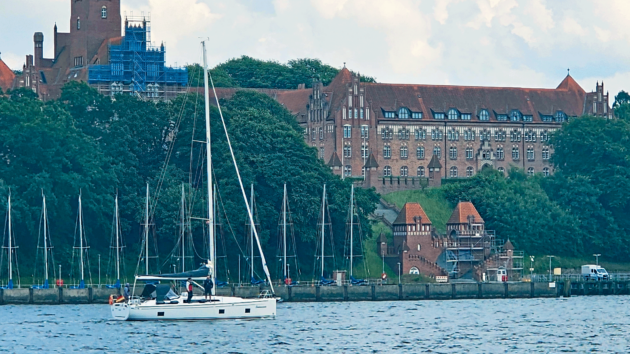 The pretty roof line of Faaborg from the sea makes for an enticing haven against the brooding sky
