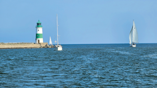 The entrance to the narrow inlet Schlei is marked by a lighthouse at the end of a causeway