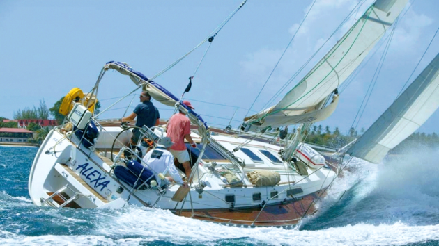 Leading the fleet and looking to tack and lay the finishing line