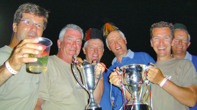 Bunch of people holding cups and smiling