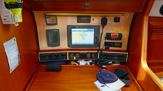 Facing outboard, the chart table faces outboard, with moderately recent electronics