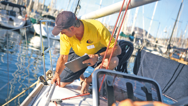 Rob Gaffney inspectsthe boat