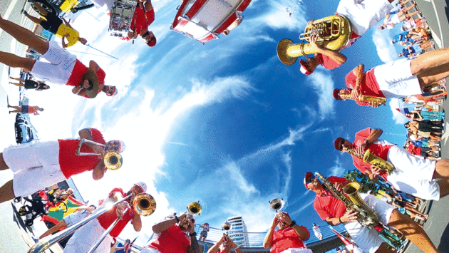 View looking up at people of standing in a circle