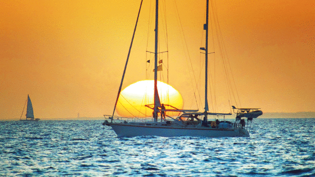 Sundown off GranCanaria and some boats are still motoring through the light airs