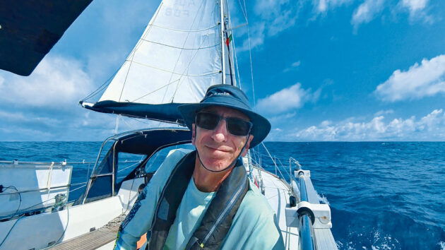 Mike Reynolds smiling on a yacht