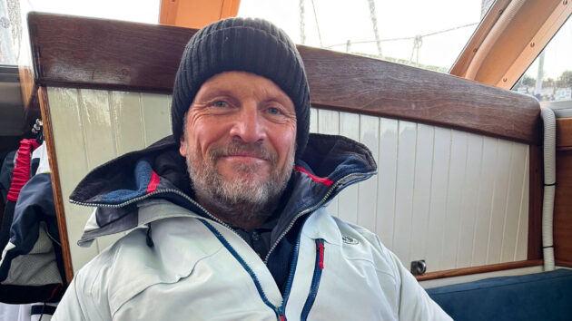 Justin Morton smiling inside a yacht