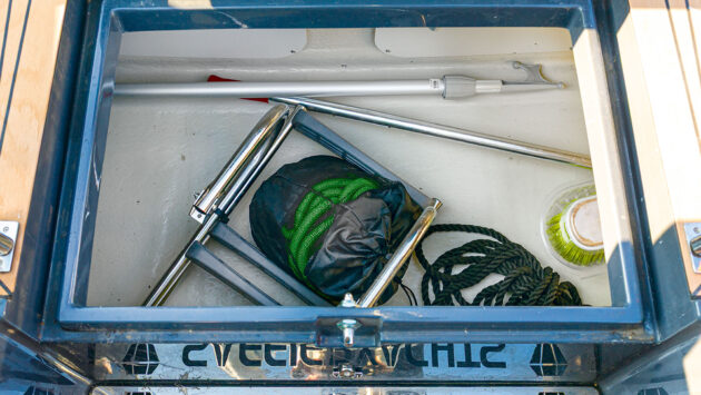 A locker abaft the wheel holds warps, fenders, deck brushes and other larger gear