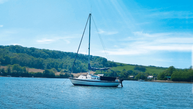 Anchored off a coast under a blue sky