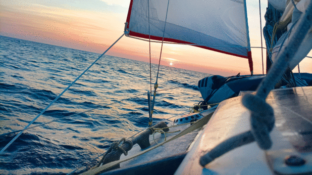 On board a yacht with a sunset behind