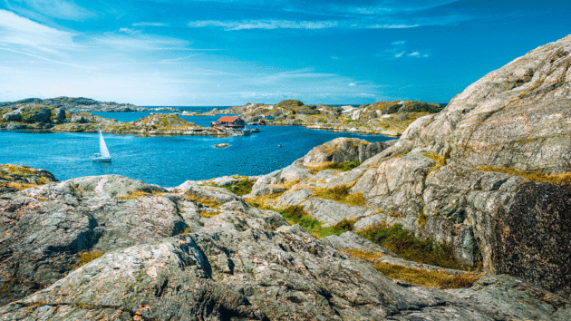 Gorgeous rocky area with a yacht in the background