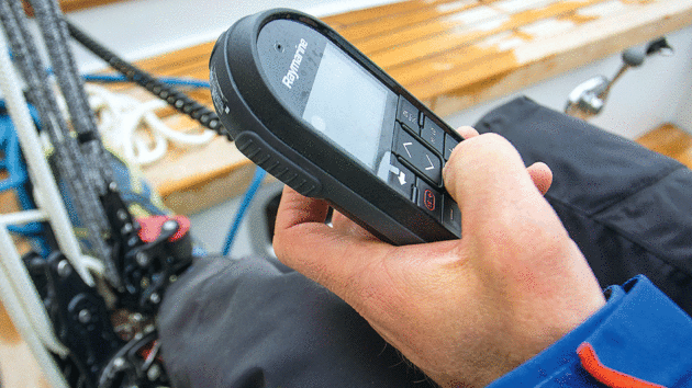Someone holding a VHF radio