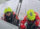 Two people on a yacht in a shower