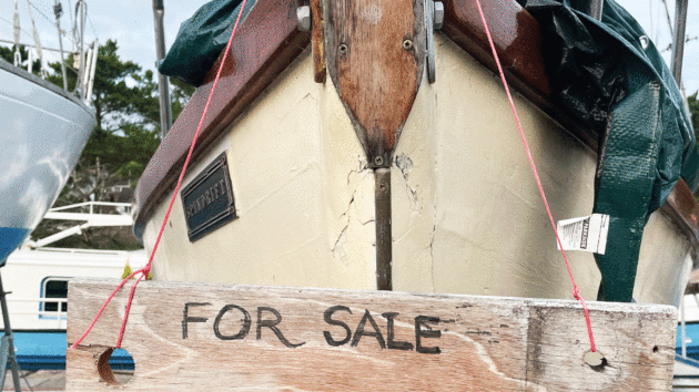 A boat with a For Sale sign