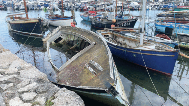 A wooden Oyster Dredger laid up and wrecked