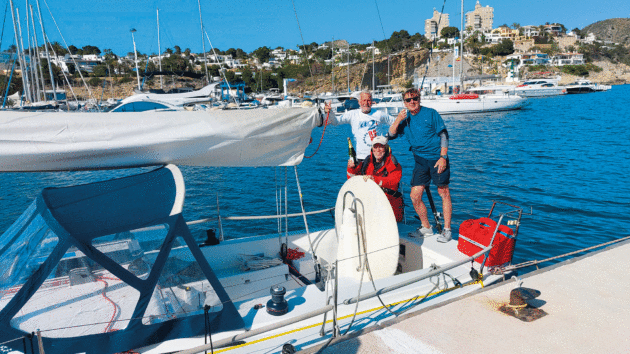 author Barry McCrae, owner Richard Pipkin, first mate Andrew Guilbert on the boat in Spain