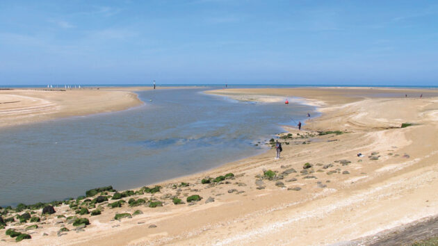 Looking out of the channel from the embankment at low waterwater