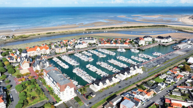 The large, locked marina basin at Dives, with empty visitors’ berths near the narrower entrance