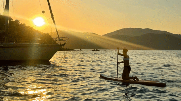 Sunset with someone paddleboarding