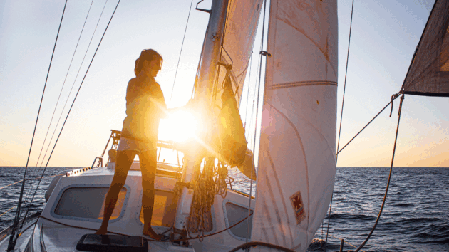 Someone with sunset behind on a yacht