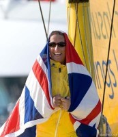 Dee Caffari celebrates coming sixth