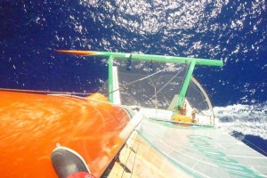 Groupama 3, crewman up the mast