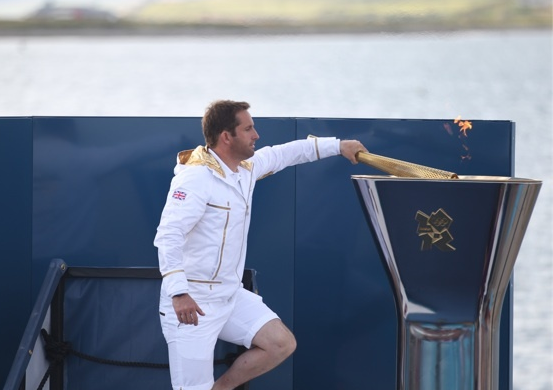 Ainslie lights Olympic flame