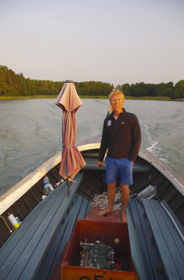 Andy at the hlem of Claes's boat