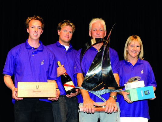 Paul and Mari-Claude Heys and crew take the trophy. Photo: Rick Tomlinson