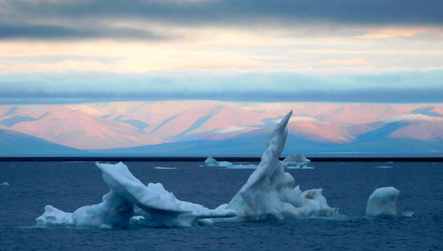 Alaskan coast at midnight sunset