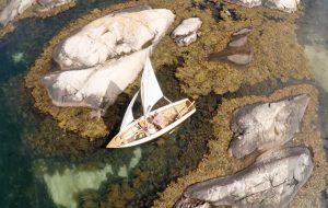 Inch-perfect pilotage between the rocks along the coast of Norway aboard a Kragero Terne.