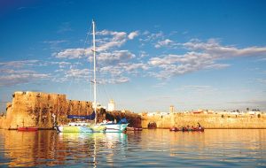 A winter adventure: yacht Hummingbird moored just off the old Portuguese fortifications of El Jadida