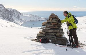 Adding a stone to the cairn above Ocean Harbour on the east side of South Georgia.