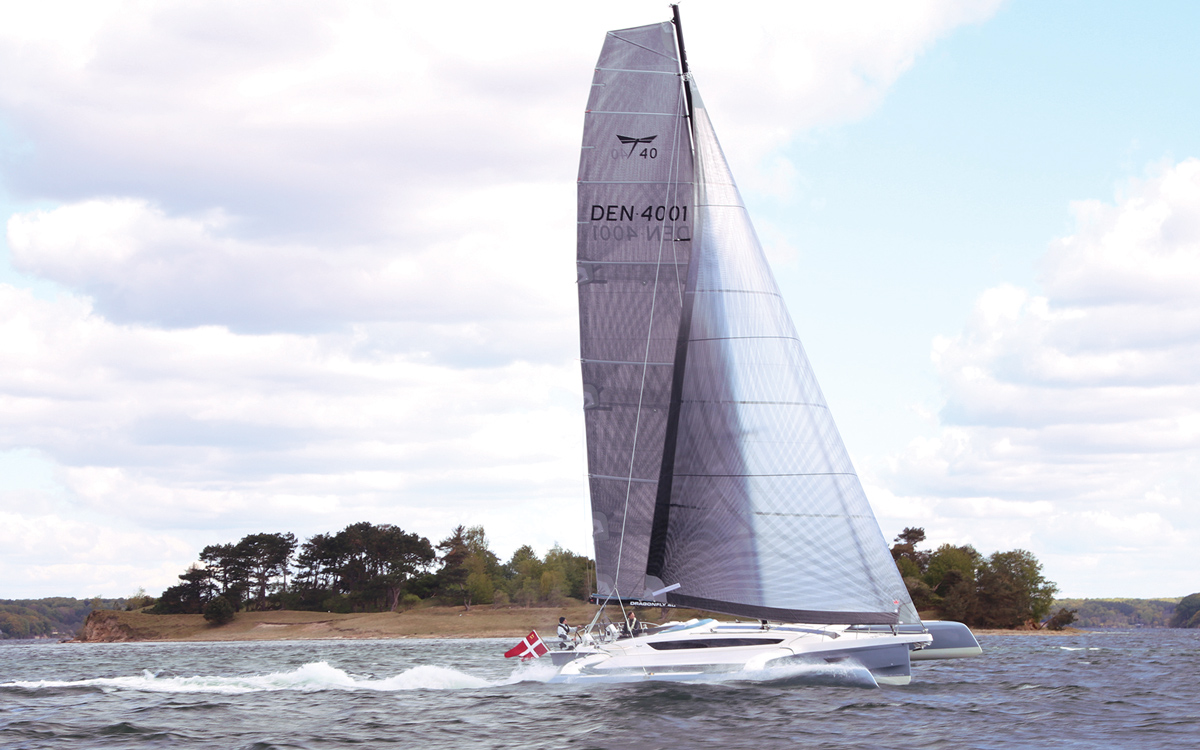 mainsail-handling-multihull-catamaran-sailing-techniques-Dragonfly-40-running-shot-credit-Al-Wood