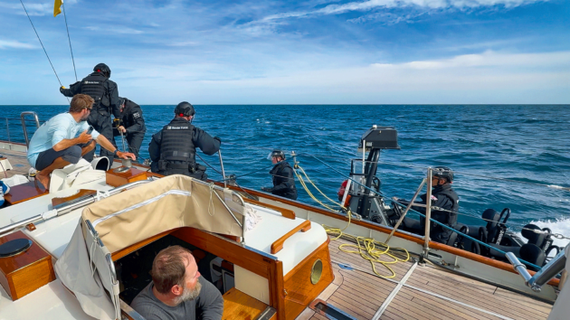 UK Border Force officers climb aboard Hound.