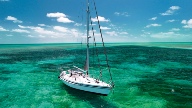Yacht moored in green water
