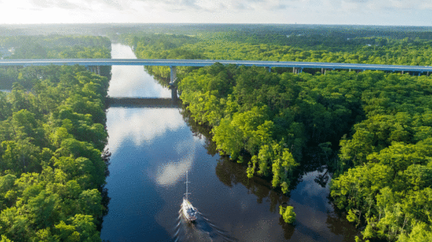 Aerial view of a yacht in a channel