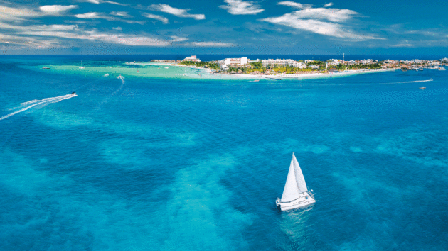 Aerial photo of a yacht in azure water