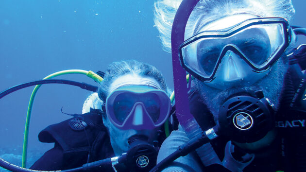 Two people in scuba gear underwater