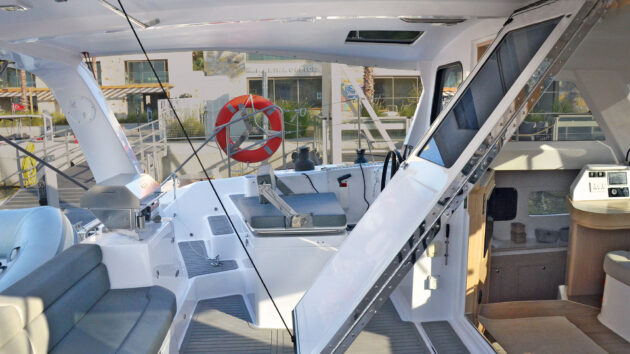 Seawind’s ‘magic door’ folds up to be secured against the bimini roof to completely open up the space between the saloon and the cockpit. 