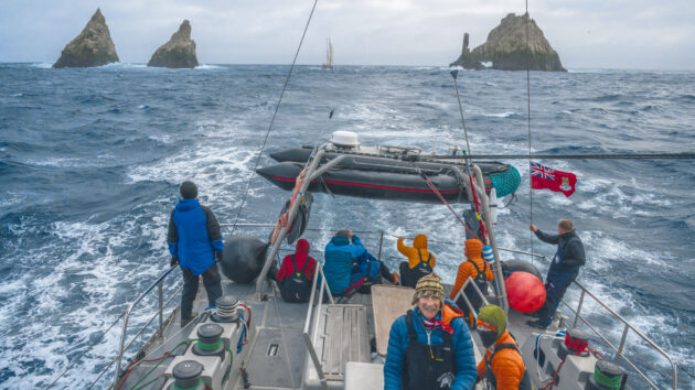 Skip at Vinson of Antarctica’s helm with Amundsen in her wake at the Shag Rocks, passing through the narrow gap with 12m of water