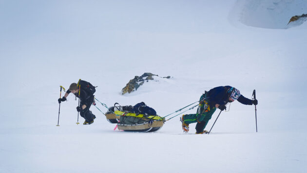 Luca and Skip struggling with towing their pulks up to the Razorback Ridge.