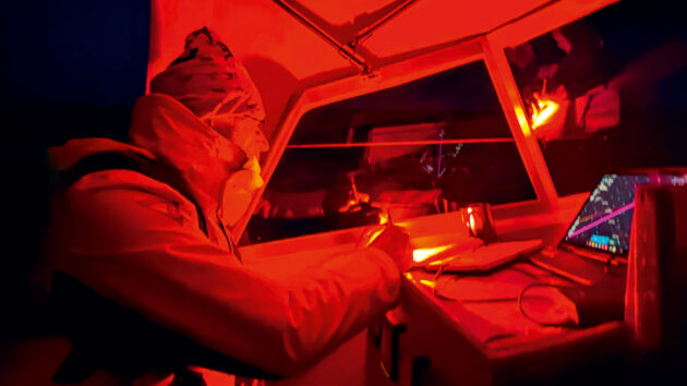 Gerd at the navigation table under a red light