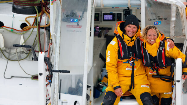 Dee Caffari and another sailor smiling on the yacht