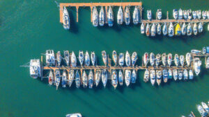 Aerial shot of boats lined up against a pontoon