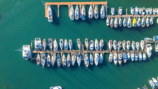 Aerial shot of boats lined up against a pontoon