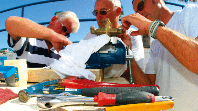 Some people gathered arounds some tools